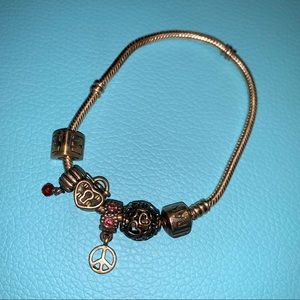 Used Pandora bracelet with five charms